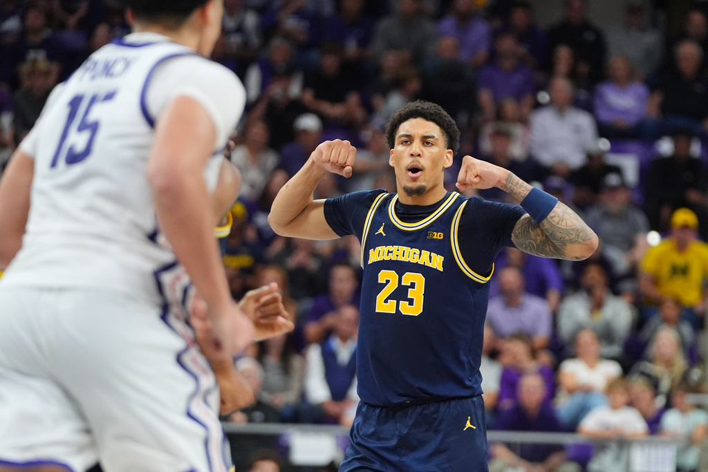 Michigan forward Yaxel Lendeborg (23) reacts after scoring against TCU forward David Punch (15) during the second half of an NCAA college basketball game in Fort Worth, Texas, Friday, Nov. 14, 2025. (AP Photo/LM Otero)
