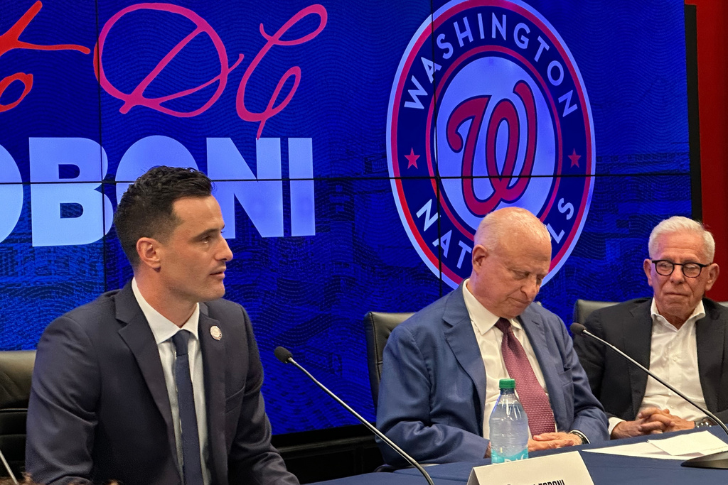 Washington Nationals new president of baseball operations Paul Toboni, left, and team owners Mark Lerner, center, and Edward Cohen, right, appear at a news conference at Nationals Park in Washington, Wednesday, Oct. 1, 2025. (AP Photo/Howard Fendrich)
