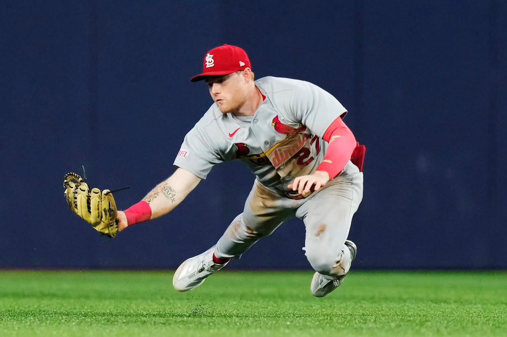 St. Louis Cardinals outfielder Nathan Church makes a diving catch on a ball hit by Toronto Blue Jays' Ernie Clement (22) during the sixth inning of a baseball game in Toronto, Friday, July 31, 2026. (Chris Young/The Canadian Press via AP)