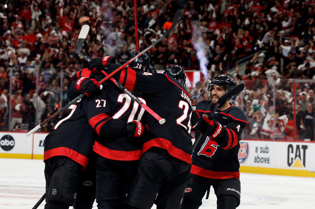 Carolina Hurricanes players celebrate after a goal by Andrei Svechnikov during the second period in Game 5 of the NHL hockey Stanley Cup Final series against the Vegas Golden Knights in Raleigh, N.C., Thursday, June 11, 2026. (AP Photo/Karl DeBlaker)