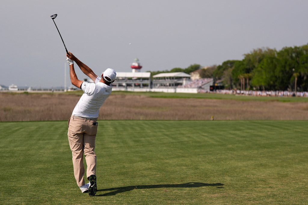 Scottie Scheffler hits from the 18th tee during the third round of the RBC Heritage golf tournament Saturday, April 18, 2026, in Hilton Head, S.C. (AP Photo/Mike Stewart)