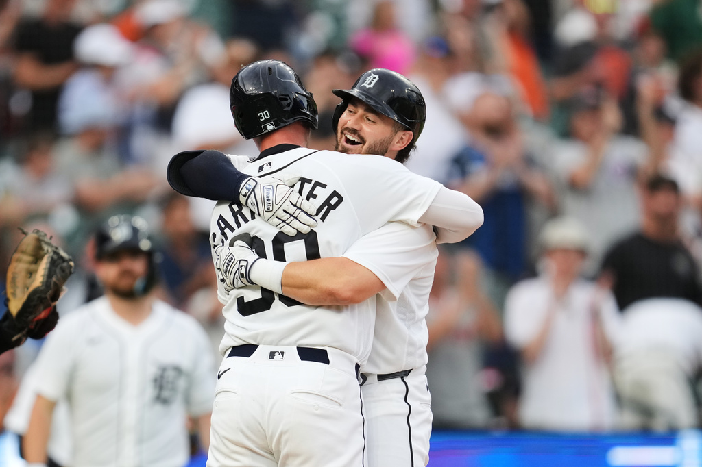 Detroit Tigers' Zach McKinstry celebrates his two-run home run with Kerry Carpenter (30) against the Athletics during the fifth inning of a baseball game Thursday, July 9, 2026, in Detroit. (AP Photo/Paul Sancya)
