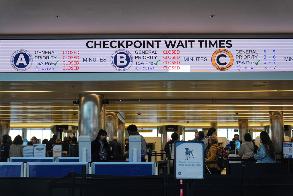 Security checkpoint closures are displayed on an information board in the terminal at Baltimore/Washington International Thurgood Marshall Airport in Baltimore, Monday, Nov. 10, 2025. (AP Photo/Stephanie Scarbrough)