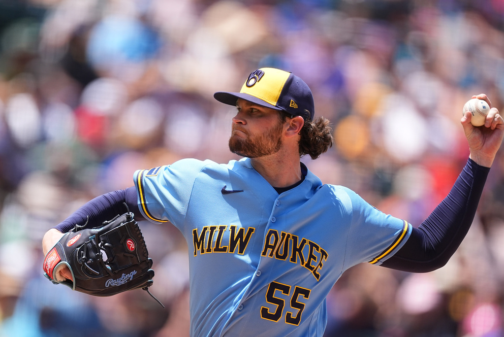 Milwaukee Brewers starting pitcher Shane Drohan works against the Colorado Rockies in the first inning of a baseball game Sunday, June 7, 2026, in Denver. (AP Photo/David Zalubowski)