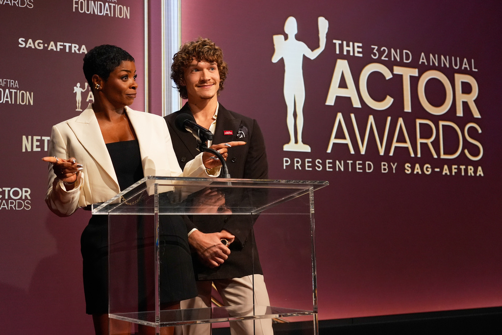 Janelle James, left, and Connor Storrie present the nominees for the 32nd Annual Actor Awards on Wednesday, Jan. 7, 2026, in Los Angeles. (AP Photo/Chris Pizzello)