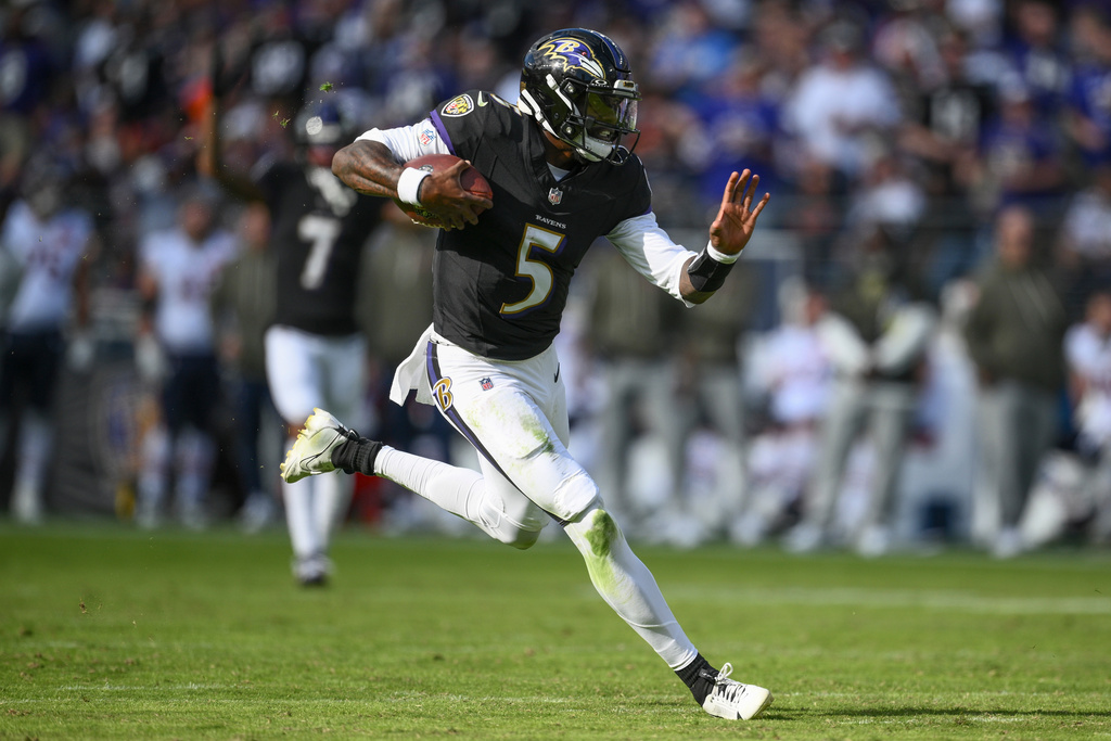 Baltimore Ravens quarterback Tyler Huntley (5) runs the ball during the second half an NFL football game against the Chicago Bears, Sunday, Oct. 26, 2025, in Baltimore. (AP Photo/Nick Wass)