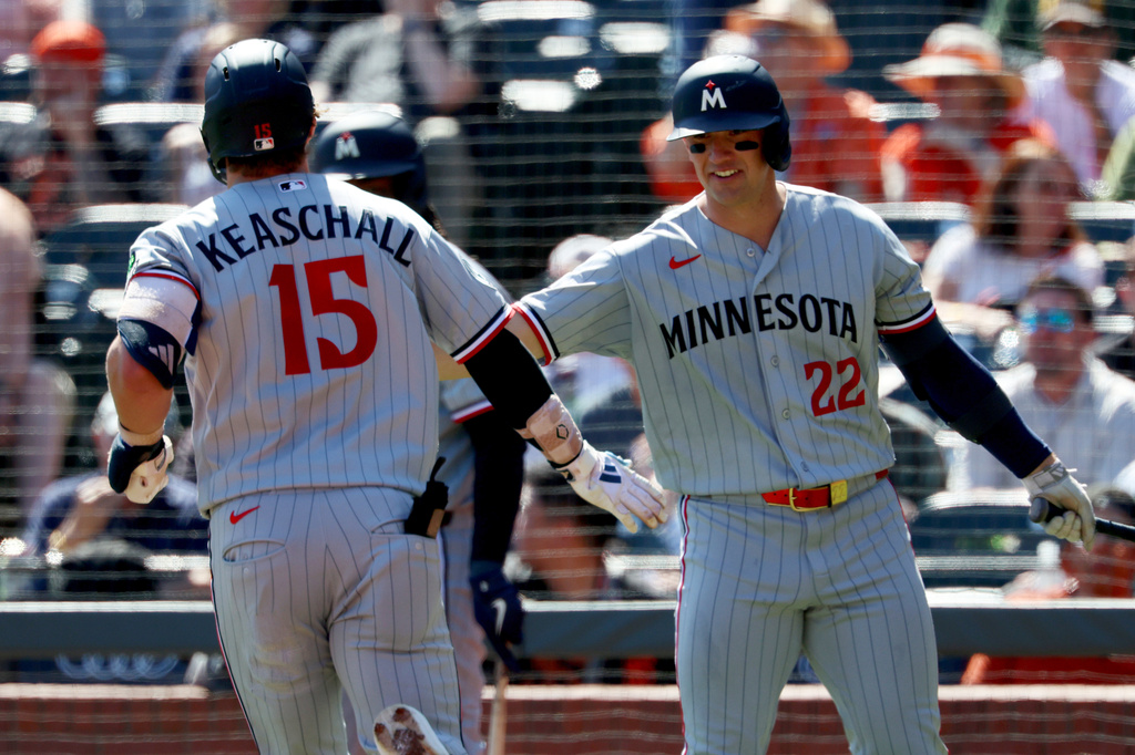 Minnesota Twins' Luke Keaschall (15) is congratulated by Brooks Lee (22) after hitting a solo home run during the third inning of a baseball game against the San Francisco Giants in San Francisco, Wednesday, Sept. 23, 2026. (AP Photo/Jed Jacobsohn)