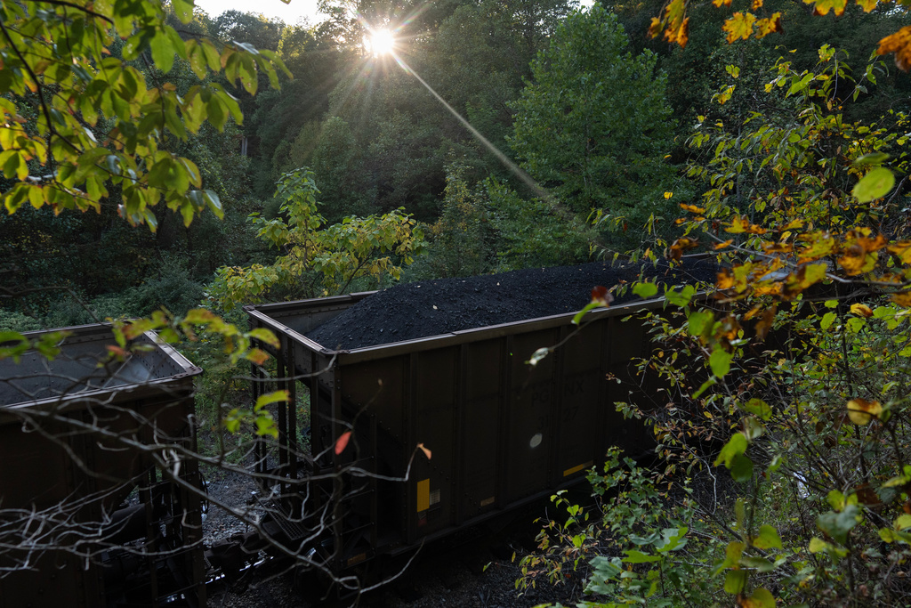A train car carrying coal moves through Oak Hill, W.Va, at sunset on Sept. 17, 2025. (AP Photo/Carolyn Kaster)