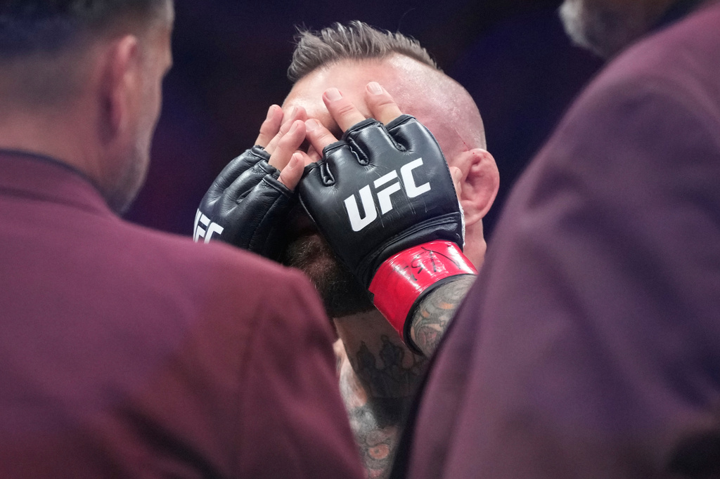 Conor McGregor reacts after losing to Max Holloway in a welterweight fight at the UFC 329 mixed martial arts event Saturday, July 11, 2026, in Las Vegas. (AP Photo/John Locher)