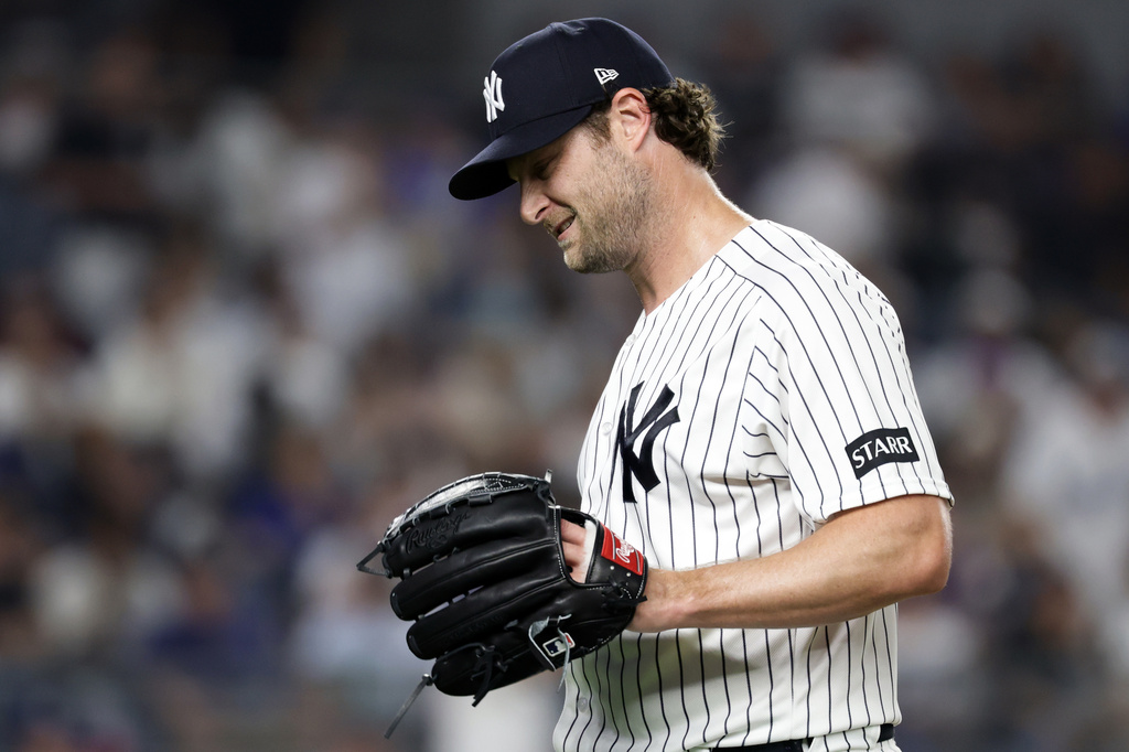 New York Yankees pitcher Gerrit Cole reacts while walking to the dugout after giving up a two-run home run to Los Angeles Dodgers' Max Muncy during the seventh inning of a baseball game Friday, July 17, 2026, in New York. (AP Photo/Adam Hunger)