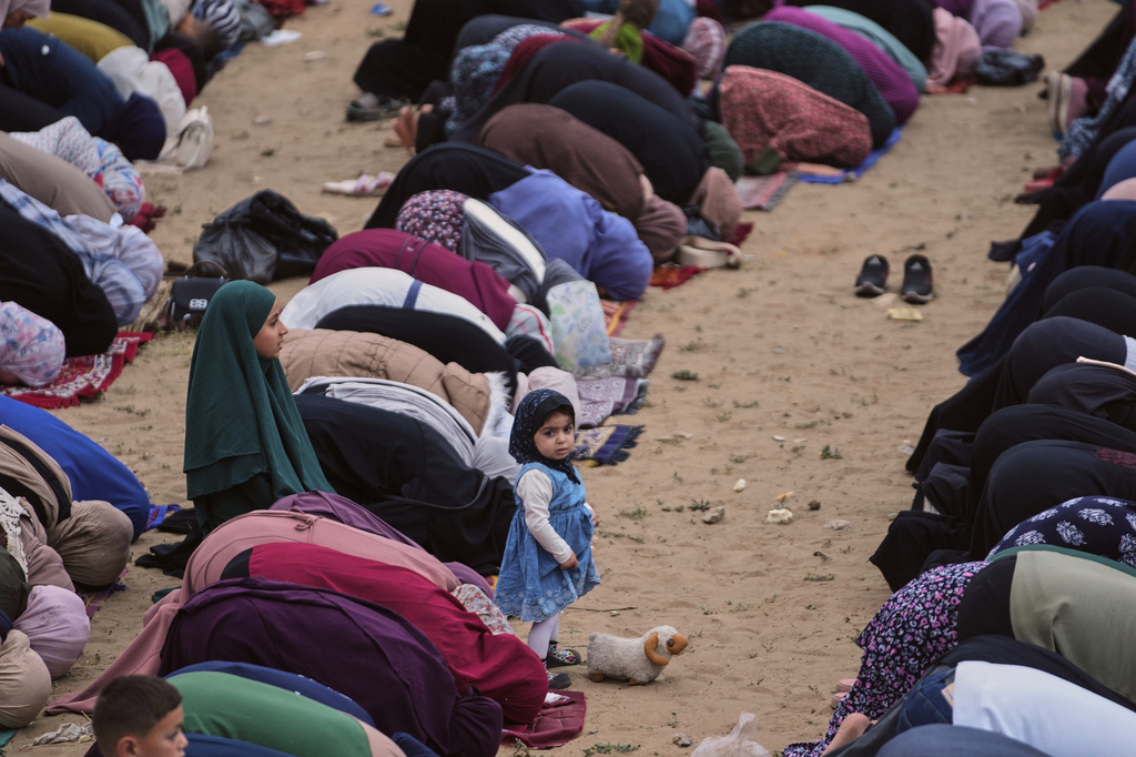 Muslims worshipers offer Eid al-Adha prayers in Gaza City Wednesday, May 27, 2026. (AP Photo/Jehad Alshrafi)