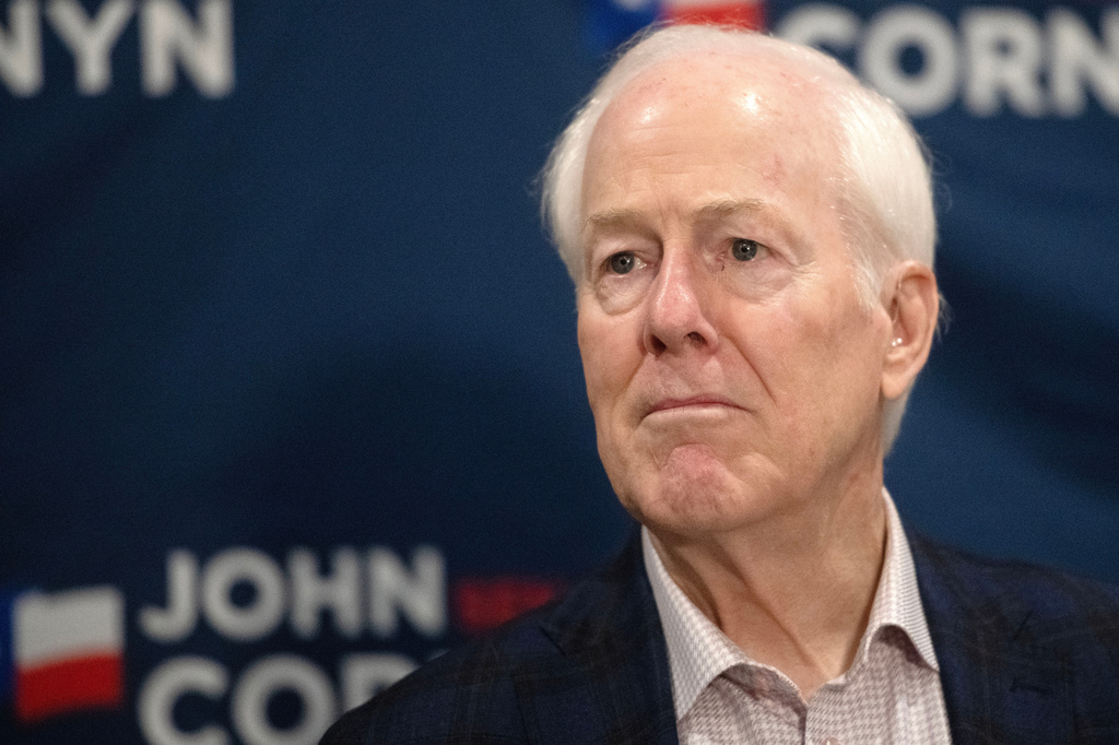 Sen. John Cornyn, R-Texas, listens to State Sen. Charles Perry, R-Lubbock, during a campaign event in Lubbock, Texas, Tuesday, May 19, 2026. (AP Photo/Annie Rice)