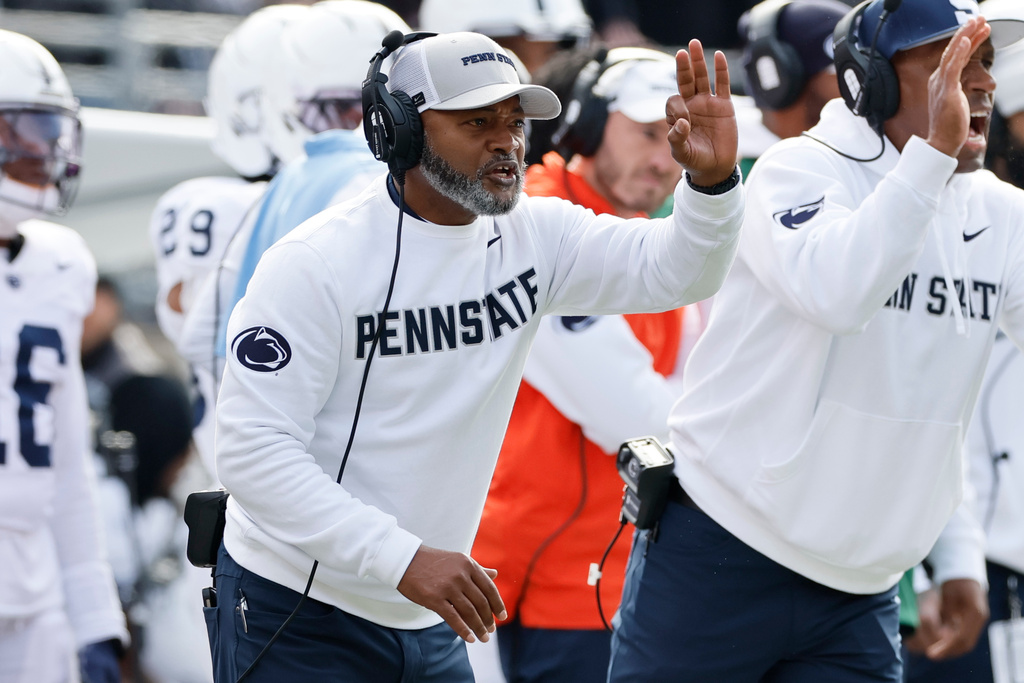 Penn State interim head coach Terry Smith signals his team during the first half of an NCAA college football game against Ohio State, Saturday, Nov. 1, 2025, in Columbus, Ohio. (AP Photo/Jay LaPrete)