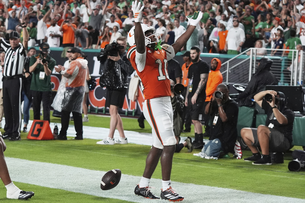Miami wide receiver Malachi Toney celebrates after scoring a touchdown during the first half of an NCAA college football game against Notre Dame, Sunday, Aug. 31, 2025, in Miami Gardens, Fla. (AP Photo/Lynne Sladky)