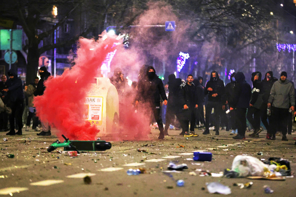 Protesters prepare to clash with police during a rally against austerity measures in next year's draft budget, in Sofia, Monday, Dec 1, 2025. (AP Photo/Valentina Petrova)