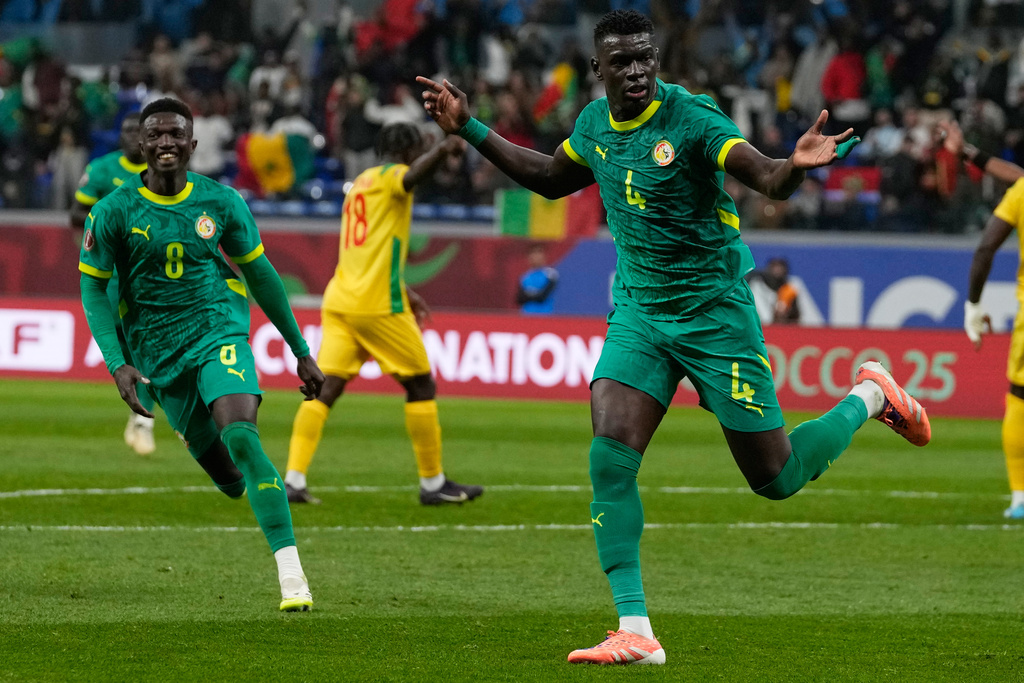 Senegal's Abdoulaye Seck, right, celebrate his goal with his teammates during the Africa Cup of Nations group D soccer match between Benin and Senegal in Tangier, Morocco, Tuesday, Dec. 30, 2025. (AP Photo/Themba Hadebe)