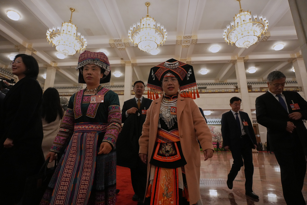 Ethnic minority delegates leave after a pre-session of the National People's Congress (NPC) at the Great Hall of the People, in Beijing, China, Wednesday, March 4, 2026. (AP Photo/Ng Han Guan)