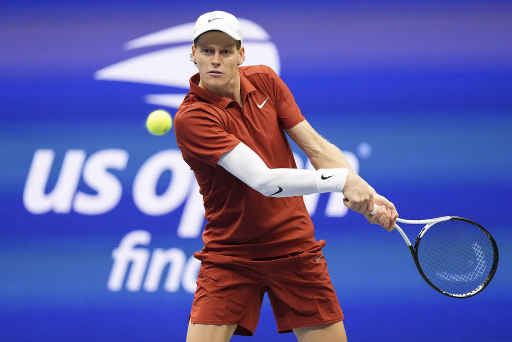 Jannik Sinner, of Italy, returns a shot to Carlos Alcaraz, of Spain, during the men's singles final of the U.S. Open tennis championships, Sunday, Sept. 7, 2025, in New York. (AP Photo/Kirsty Wigglesworth)