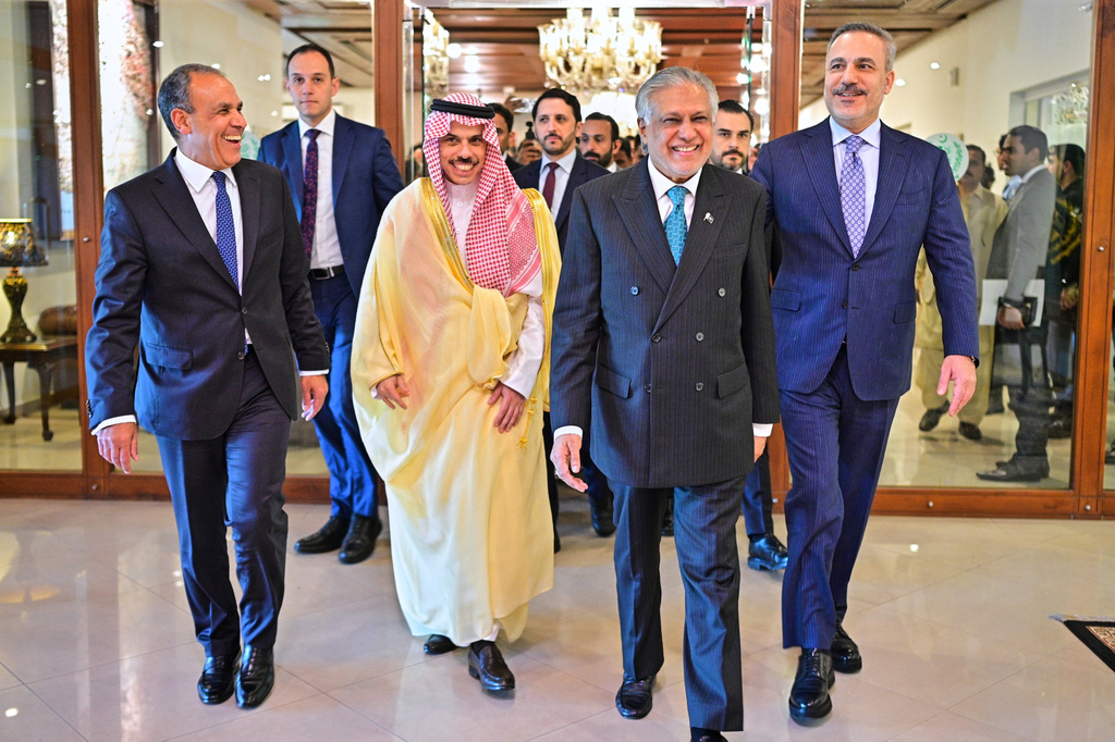 In this photo released by the Pakistan Ministry of Foreign Affairs, from left, Egyptian Foreign Minister Badr Abdelatty, Saudi Arabia's Foreign Minister Prince Faisal bin Farhan Al-Saud, Pakistan's Foreign Minister Ishaq Dar and Turkish Foreign Minister Hakan Fidan walk prior to their meeting to discuss the Middle East war, in Islamabad, Pakistan, Sunday, March 29, 2026. (Pakistan Ministry of Foreign Affairs via AP)