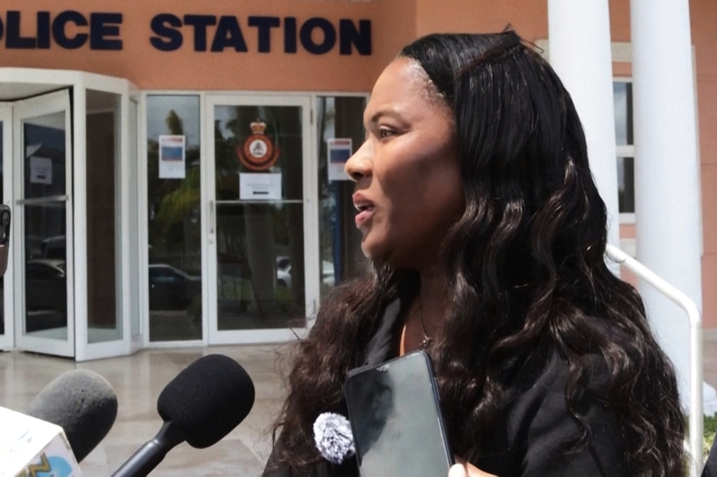 In this image taken from an Associated Press video Terrel Butler, the attorney representing Brian Hooker, talks to reporters Friday, April 10, 2026, outside the police station in Freeport, Bahamas. (AP Photo/Keith Gomez)