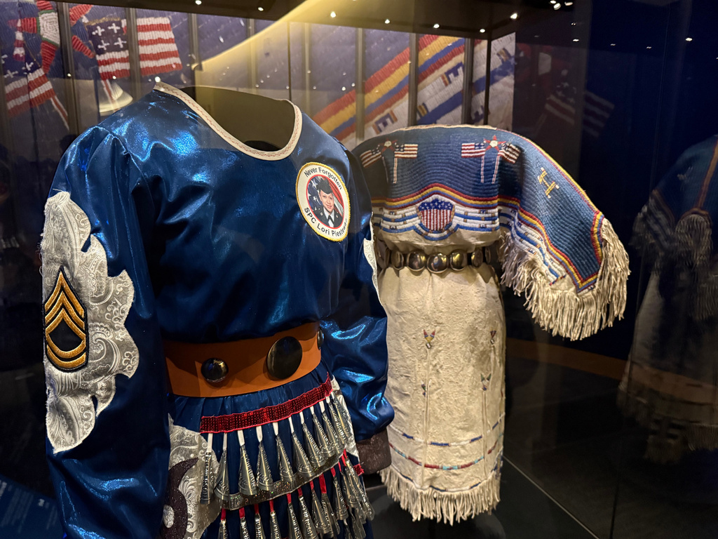 Two Native American dresses are on display as part of a commemoration of the 250th anniversary of the signing of the Declaration of Independence at the Smithsonian's National Museum of the American Indian in Washington, on Saturday, May 23, 2026. (Jourdan Bennett-Begaye/ICT via AP)