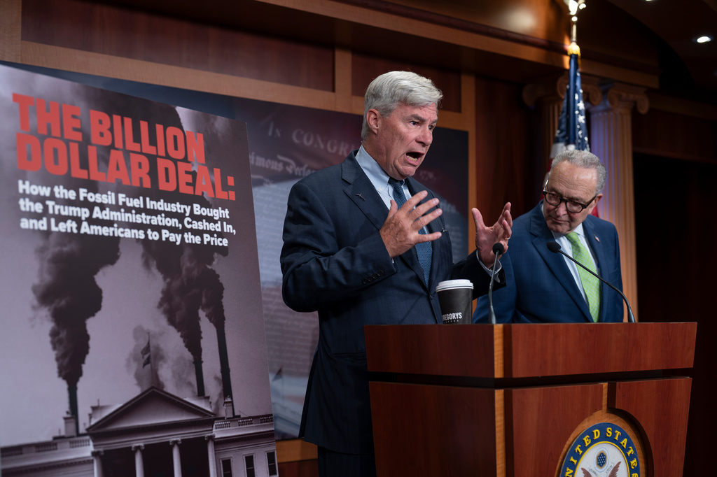Sen. Sheldon Whitehouse, D-R.I., left, and Senate Minority Leader Chuck Schumer, D-N.Y., talk to reporters about political influence by the fossil fuel industry, at the Capitol in Washington, Thursday, Sept. 24, 2026. (AP Photo/J. Scott Applewhite)
