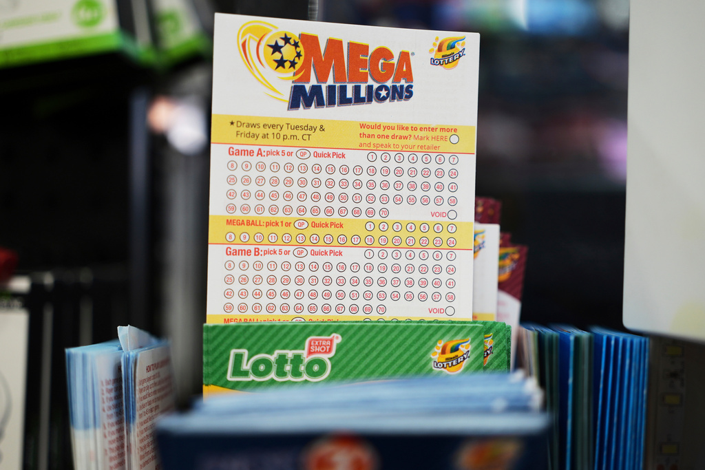 FILE - Mega Millions Lottery play slips are displayed for customers at a convenience store in Chicago, Sunday, April 6, 2025. (AP Photo/Nam Y. Huh, file)