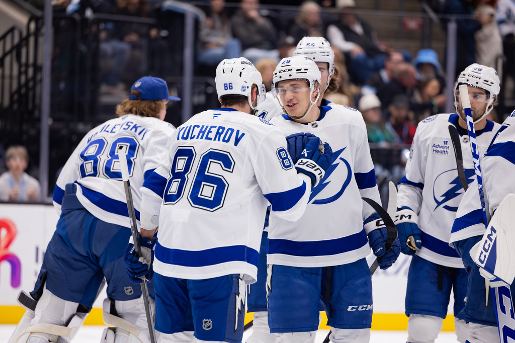 Tampa Bay Lightning right wing Pontus Holmberg (29) celebrates right wing Nikita Kucherov (86) who became the franchise's all-time points leader with an assist on center Brayden Point's goal during the first period of an NHL hockey game against the Utah Mammoth Saturday, Oct. 24, 2026, in Salt Lake City. (AP Photo/Melissa Majchrzak)