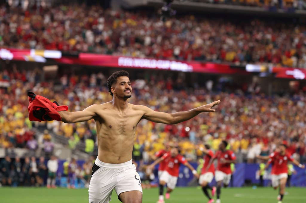 Egypt's Hossam Abdelmaguid (4) celebrates after scoring the winning penalty during World Cup round of 32 soccer match between Australia and Egypt in Arlington, Texas, near Dallas, Friday, July 3, 2026. (AP Photo/Sam Hodde)