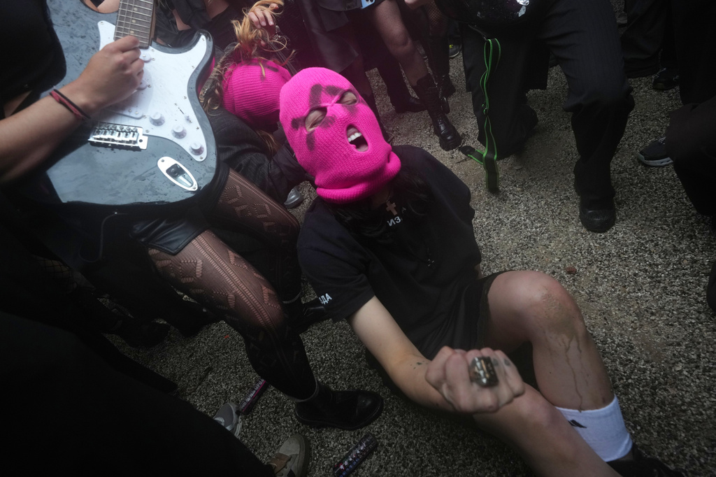 Pussy Riot and FEMEN activists stage a protest against Russia's presence after its absence following the 2022 invasion of Ukraine in front of the Russian pavilion, at the 2026 Art Venice Biennale, in Venice, Italy, Wednesday, May 6, 2026. (AP Photo/Luca Bruno)