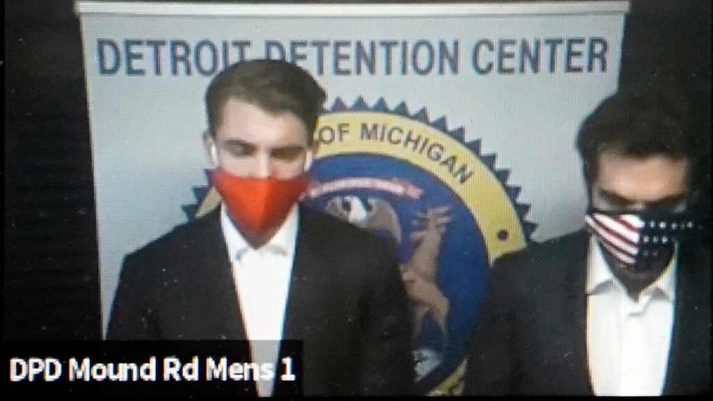 FILE - In this image taken from video provided by the 36th District Court in Michigan, Jacob Wohl, left, and Jack Burkman appear during their arraignment via video, Thursday, Oct. 8, 2020 in Detroit. (36th District Court via AP, File)