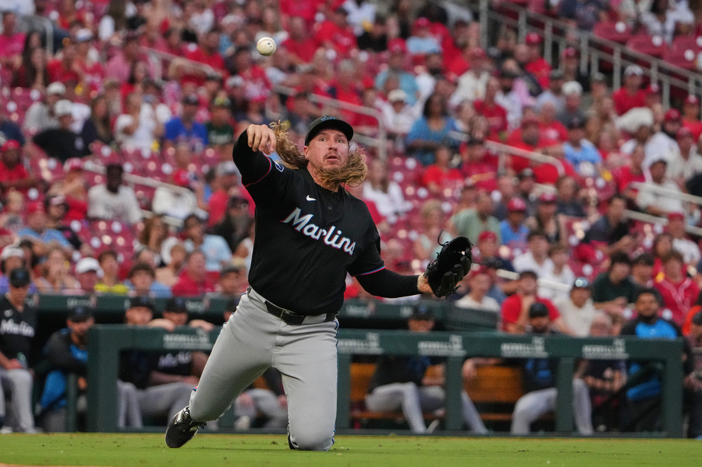Miami Marlins pitcher Lake Bachar throws out St. Louis Cardinals' Alec Burleson at first during the sixth inning of a baseball game Saturday, June 27, 2026, in St. Louis. (AP Photo/Jeff Roberson)