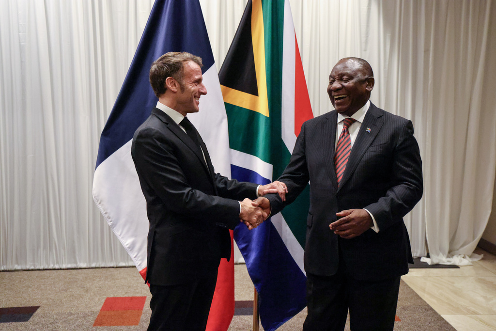 France's President Emmanuel Macron, left, shakes hands with South Africa's President Cyril Ramaphosa during their bilateral meeting at the Sandton Convention Centre in Sandton, South Africa, Friday Nov. 21, 2025, ahead of the G20 leaders' Summit. (Ludovic Marin/Pool Photo via AP)