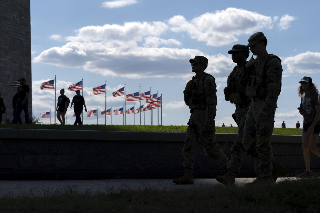 Members of the Louisiana National Guard patrol the National Mall, Sunday, Sept. 7, 2025, in Washington. (AP Photo/Jose Luis Magana)