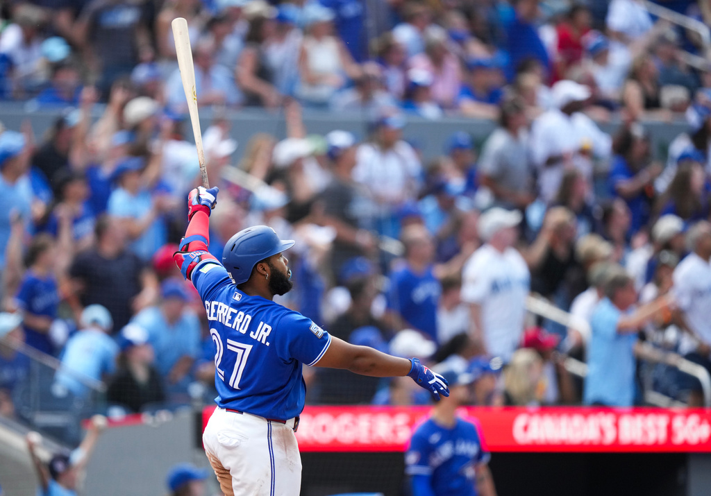 Toronto Blue Jays' Vladimir Guerrero Jr. watches his solo home run while playing against the Baltimore Orioles during the fifth inning of a baseball game in Toronto, Sunday, Sept. 13, 2026. (Nathan Denette/The Canadian Press via AP)