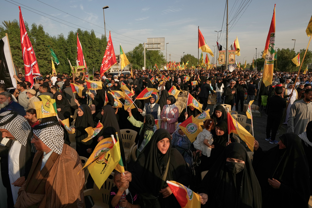 People gather during celebrations marking the complete withdrawal of U.S. troops from Iraq, in Baghdad, Iraq, Wednesday, Sept. 30, 2026. (AP Photo/Hadi Mizban)