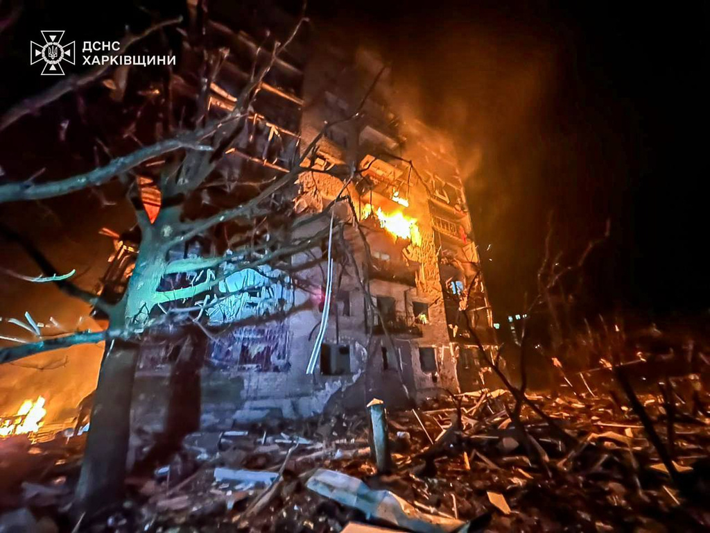 In this photo provided by the Ukrainian Emergency Service, emergency services personnel work to extinguish a fire following a Russian attack in Balakliya, Kharkiv region, Ukraine, Monday, Nov. 17, 2025. (Ukrainian Emergency Service via AP)