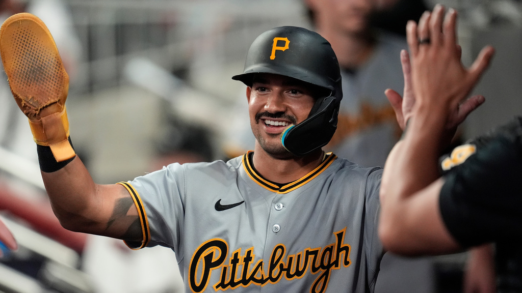 Pittsburgh Pirates' Nick Gonzales (39) celebrates scoring off the bat of Jack Suwinski in the sixth inning of a baseball game against the Atlanta Braves, Saturday, Sept. 27, 2025, in Atlanta. (AP Photo/Mike Stewart)