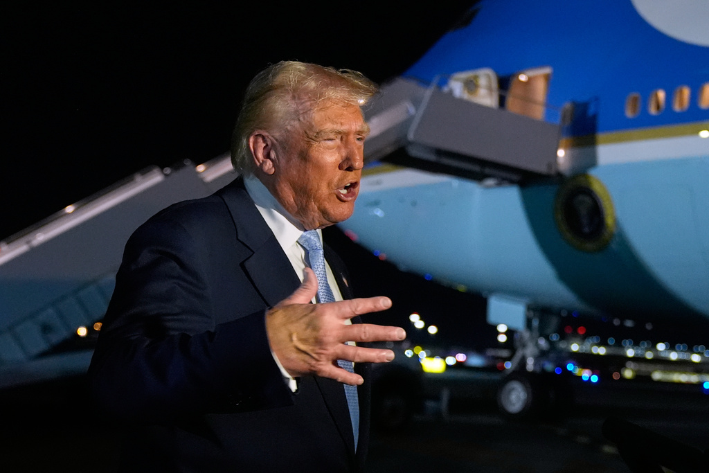President Donald Trump speaks to reporters before boarding Air Force One at Palm Beach International Airport in West Palm Beach Fla., on his way back to the White House, Sunday, Nov. 16, 2025. (AP Photo/Manuel Balce Ceneta)