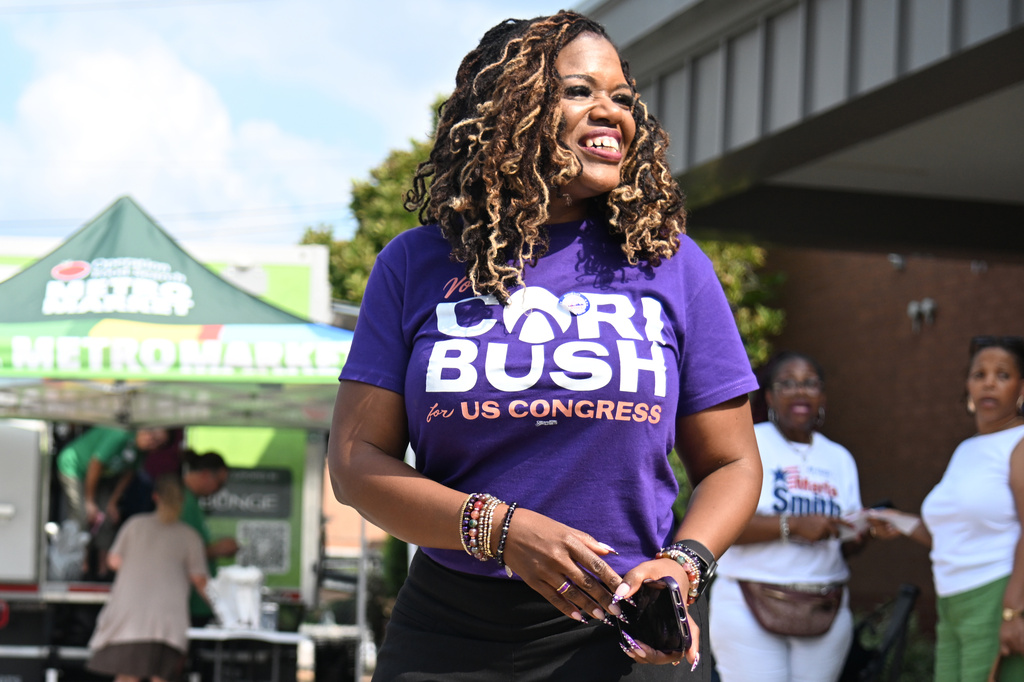 Former U.S. Rep. Cori Bush, D-Mo., greets voters during a polling location visit on primary election day Tuesday, Aug. 4, 2026, in Normandy, Mo. (AP Photo/Michael Thomas)