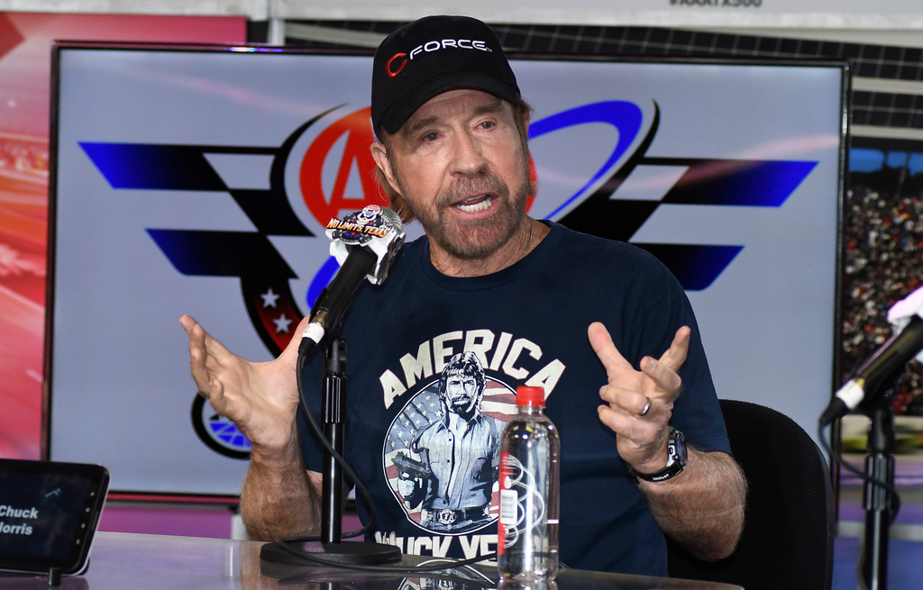 FILE - Chuck Norris speaks to reporters during a media availability before the NASCAR Sprint Cup Series auto race at Texas Motor Speedway in Fort Worth, Texas, on Nov. 6, 2016. (AP Photo/Larry Papke, File)
