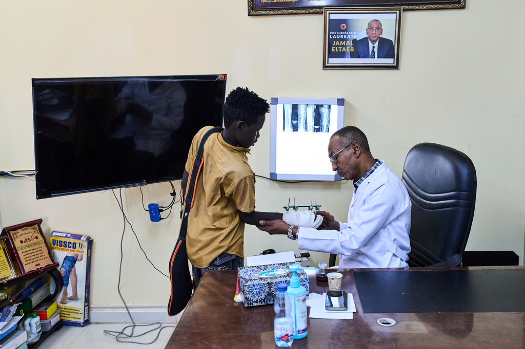 Dr. Jamal Eltaeb checks a patient at Al Nao Hospital in Omdurman, on the outskirts of Khartoum, Saturday, April 18, 2026. (AP Photo/Bernat Armangue)