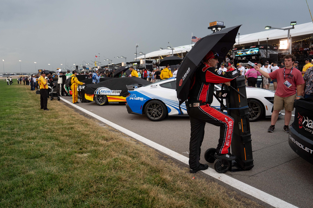 Crews wait out the rain before a NASCAR Cup Series auto race, Sunday, May 31, 2026, in Lebanon, Tenn. (AP Photo/Camden Hall)