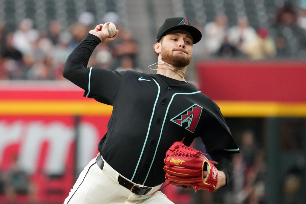 Arizona Diamondbacks pitcher Ryne Nelson throws against the San Francisco Giants in the first inning of a baseball game, Tuesday, May 19, 2026, in Phoenix. (AP Photo/Rick Scuteri)