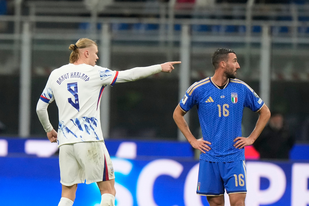 Norway's Erling Haaland, left, celebrates after scoring his side's second goal during the 2026 World Cup Group I qualifier soccer match between Italy and Norway in Milan, Italy, Sunday, Nov. 16, 2025. (AP Photo/Luca Bruno)