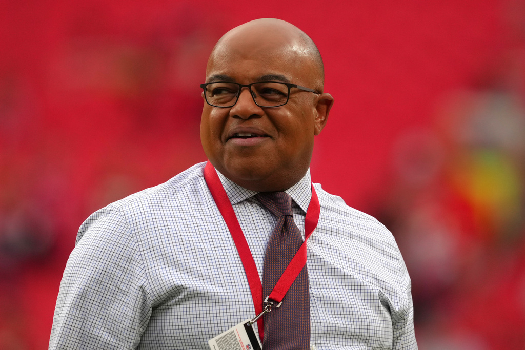 FILE - Sportscaster Mike Tirico is seen during an NFL football game, Oct. 12, 2025, in Kansas City, Mo. (AP Photo/Ed Zurga, File)