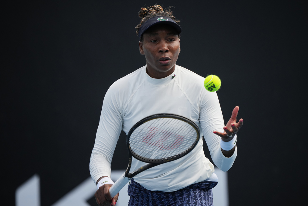Venus Williams of the United States prepares to serve during a practice session ahead of the Australian Open tennis championship in Melbourne, Australia, Friday, Jan. 16, 2026. (AP Photo/Dita Alangkara)