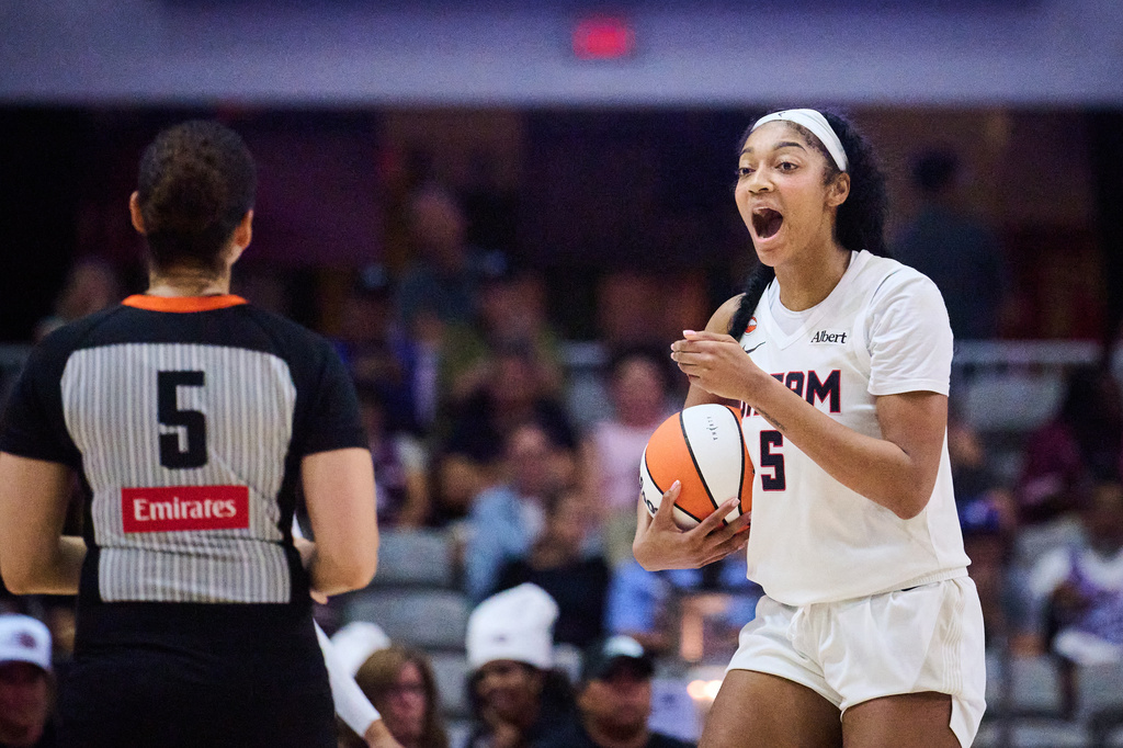 Atlanta Dream's Angel Reese, right, reacts to a foul being called against her during the second half of a WNBA basketball game against the Toronto Tempo in Toronto, Friday, July 17, 2026. (Sammy Kogan/The Canadian Press via AP)
