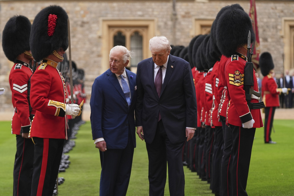 President Donald Trump and Britain's King Charles III inspect the guard of honor during an arrival ceremony at Windsor Castle, in Windsor, England, Wednesday, Sept. 17, 2025. (AP Photo/Evan Vucci)