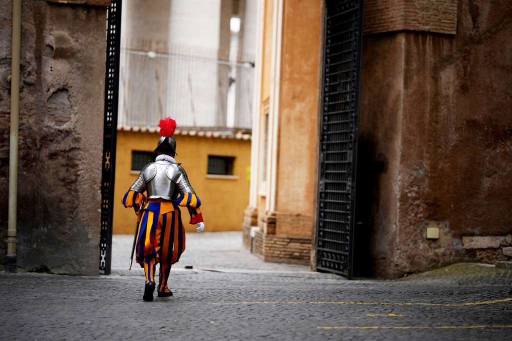A Pontifical Swiss Guards marches ahead of a swearing in ceremony, at the Vatican, Wednesday, May 6, 2026. (AP Photo/Andrew Medichini)